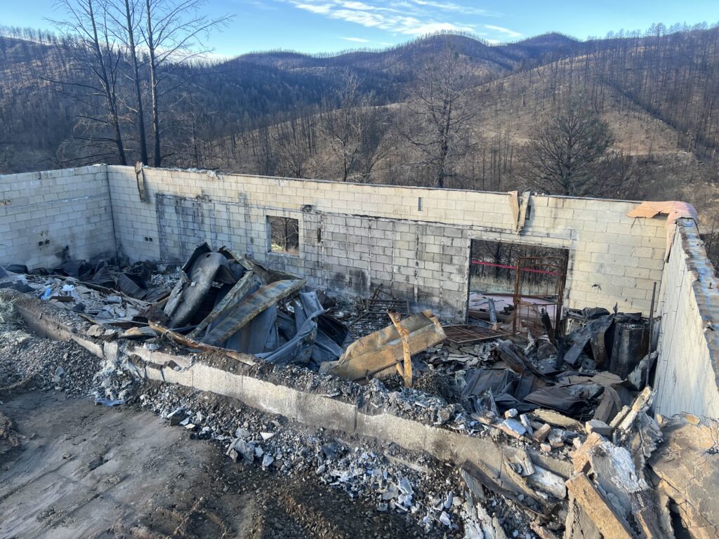 home fire debris following a wildfire